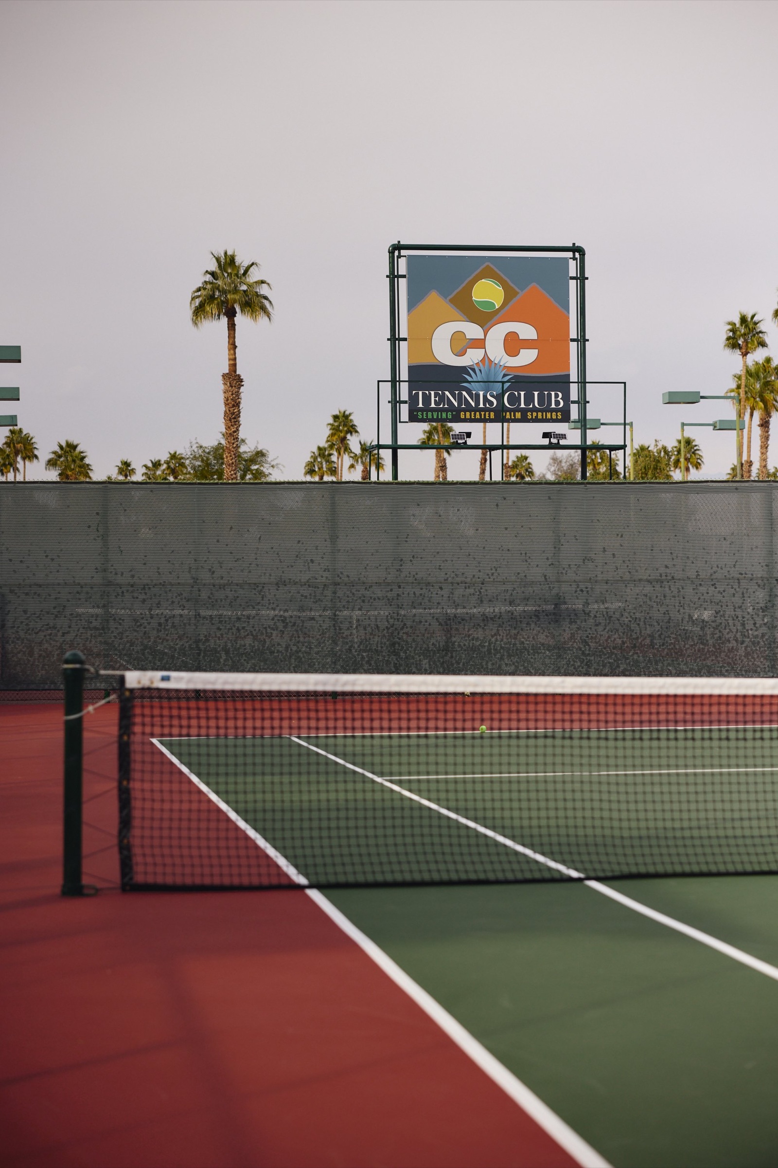 The CC Tennis Club sign against the San Jacinto Mountains