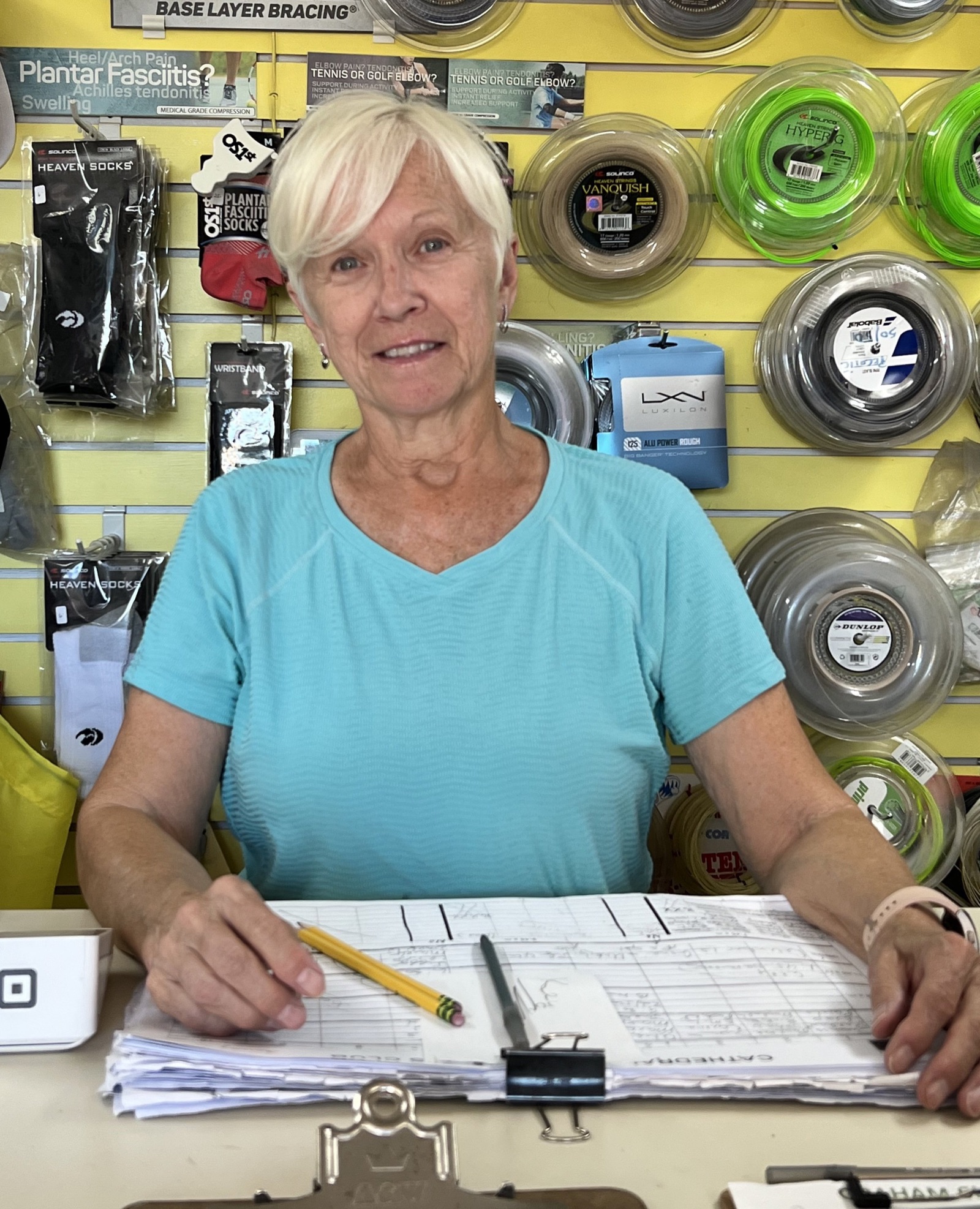 Terri Mindell, Club Manager, at the pro shop counter